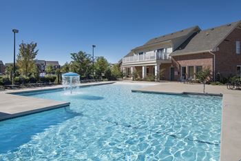 Resort style swimming pool w/ mushroom fountain